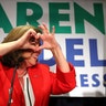 Karen Handel makes a heart symbol to thank her supporters during her election night party on Tuesday, in Atlanta