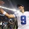 Tony Romo (9) celebrates after an NFL wildcard playoff football game against the Detroit Lions, Sunday, Jan. 4, 2015, in Arlington, Texas