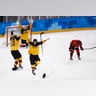 Germany players celebrate defeating Canada in their semi-final match at the 2018 Winter Olympics