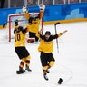 Germany players celebrate defeating Canada in their semi-final match at the 2018 Winter Olympics