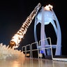 South Korean Olympic figure skating champion Yuna Kim lights the Olympic flame at the Pyeongchang Winter Olympics