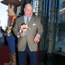 Don Rickles holds a Mr. Potato Head toy as he poses standing on top of his star on the Hollywood Walk of Fame on October 17, 2000