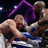 Floyd Mayweather Jr. connects with a punch against Conor McGregor in a super welterweight boxing match Saturday in Las Vegas