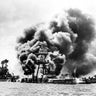 Battleships damaged and burning after Japanese attack 