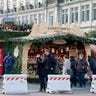 A police officer positions concrete blocks at an entrance to the Striezelmarkt Christmas market in Dresden, eastern Germany, Tuesday Dec. 20, 2016, after a truck ran into a crowded Christmas market in Berlin the evening before and killed several people. 