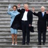 First lady Melania Trump, President Donald Trump, Vice President Mike Pence and his wife Karen wave to former President Barack Obama as he departs in a Marine helicopter on the East Front of the U.S. Capitol in Washington.