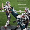 New England Patriots quarterback Tom Brady fumbles the ball during the fourth quarter in Super Bowl 52, in Minneapolis