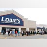 People line up at Lowe's to get supplies after rains and floods from Tropical Storm Harvey started to subside, Wednesday, in Atascocita, Texas
