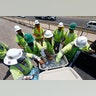 Crew members building the Loop 202 South Mountain Freeway take a break as temperatures climb to near-record highs in Phoenix, Tuesday