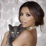 Eva Longoria posing with cat to promote Sheba cat food