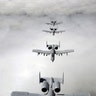 Four A-10 Thunderbolt II aircraft in formation