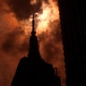The solar eclipse is seen over the Empire State Building in New York City, August 21