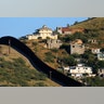 Buildings in Nogales, Mexico separated by a border fence from Nogales, Arizona, United Sates.