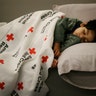 Malachia Medrano, 2, sleeps at the George R. Brown Convention Center being used as a shelter for evacuees in Houston, Texas, Tuesday