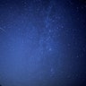 A meteor streaks past the Milky Way above Leeberg Hill during the Perseid meteor shower in Grossmugl, Austria, August 12, 2018