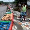 A resident look at damage caused by heavy rains of Tropical Storm Nate on Masachapa river in Managua, Nicaragua October 5,2017