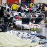 People at the George R. Brown Convention Center for evacuees escaping the floodwaters from Tropical Storm Harvey in Houston, Tuesday