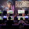 Gamers test out computer games at Gamescom in Cologne, Germany, Aug. 22, 2017