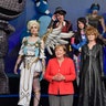 German chancellor Angela Merkel poses with cosplayers at the Gamescom fair for computer games
