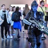 A cosplayer dressed as the fantasy figure Widowmaker from the videogame 'Overwatch' at Gamescom 
