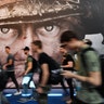 Visitors passing an advertisement for the video game 'Call of Duty' at Gamescom