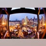 People walk over the traditional Christmas market in Frankfurt, Germany.