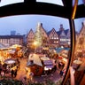 People walk over the traditional Christmas market in Frankfurt, Germany.