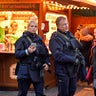 Police officers patrol at the Christmas market in Dortmund, Germany, Tuesday Dec. 20, 2016. A truck ran into a crowded Christmas market in Berlin the evening before and killed several people.