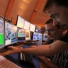 Scientists in control room of Large Hadron Collider