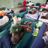 Sick prisoners rest in the infirmary at the National Penitentiary in downtown Port-au-Prince, Haiti. 