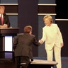 Democratic presidential nominee Hillary Clinton shakes hands with moderator Chris Wallace at the final debate