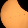 The International Space Station as it transits the Sun at roughly five miles per second during partial solar eclipse, near Banner, Wyoming