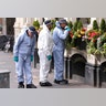 A forensic police officer investigates around the Borough Market and London Bridge area of London