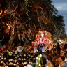 A float follows a marching band during the Krewe of Bacchus Mardi Gras parade in New Orleans.