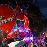 Float riders toss beads during the Krewe of Bacchus Mardi Gras parade in New Orleans.