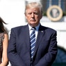 President Donald Trump and first lady Melania Trump stand during a moment of silence to remember the victims