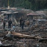 Local policemen walk through the scorched ground where the open-air San Pablito fireworks market stood. The explosion destroyed Mexico’s best-known fireworks market, injuring scores and killing dozens, according to Mexican Federal Police.