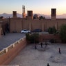 Children playing soccer at sunset in Yazd