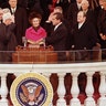 Pat Nixon holds the Bible for her husband, Richard Nixon, as he takes the oath of office, Jan. 20, 1969. 