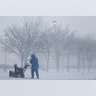 The snow in Jersey City, N.J., forced people to bring out their snowblowers early, Thursday, Feb. 9, 2017.