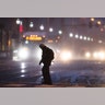 A man crosses Market Street during a winter storm in Philadelphia, Thursday, Feb. 9, 2017. 