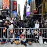 Spectators gather ahead of the New Year's Eve celebration in Times Square in New York
