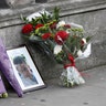 Flowers and a photo of killed police officer Keith Palmer on Whitehall near the Parliament in London, March 23, 2017.