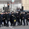 Police officers walk through Parliament in London, Wednesday, March 22, 2017.