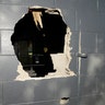 Police blasted a hole through an outside wall to provide an exit for many people trapped inside. 