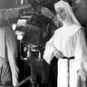 Nov. 15, 1965: Debbie Reynolds, dressed as nun for her role as a singing nun in the MGM picture of that name, practices her next scene while she watches a scene being filmed. 