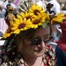 Woman wears sunflower hat at Kentucky Derby