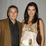 Actor Christopher Knight (L) and Adrianne Curry arrive for a private performance of Cirque du Soleil's production of Delirium in Los Angeles September 14, 2006. REUTERS/Fred Prouser  (UNITED STATES) - RTR1HCPK