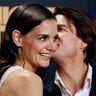 U.S. actor Tom Cruise (R) kisses his wife, actress Katie Holmes during a photo call for the world premiere of his film 