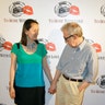 Director of the movie and cast member Woody Allen (R) poses as he arrives for a photocall to promote his upcoming film 